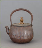 small iron teapot