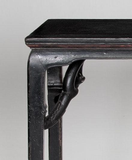 side table with giants armbraces, detail